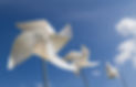 White pinwheel andwith blue sky and white cloud background