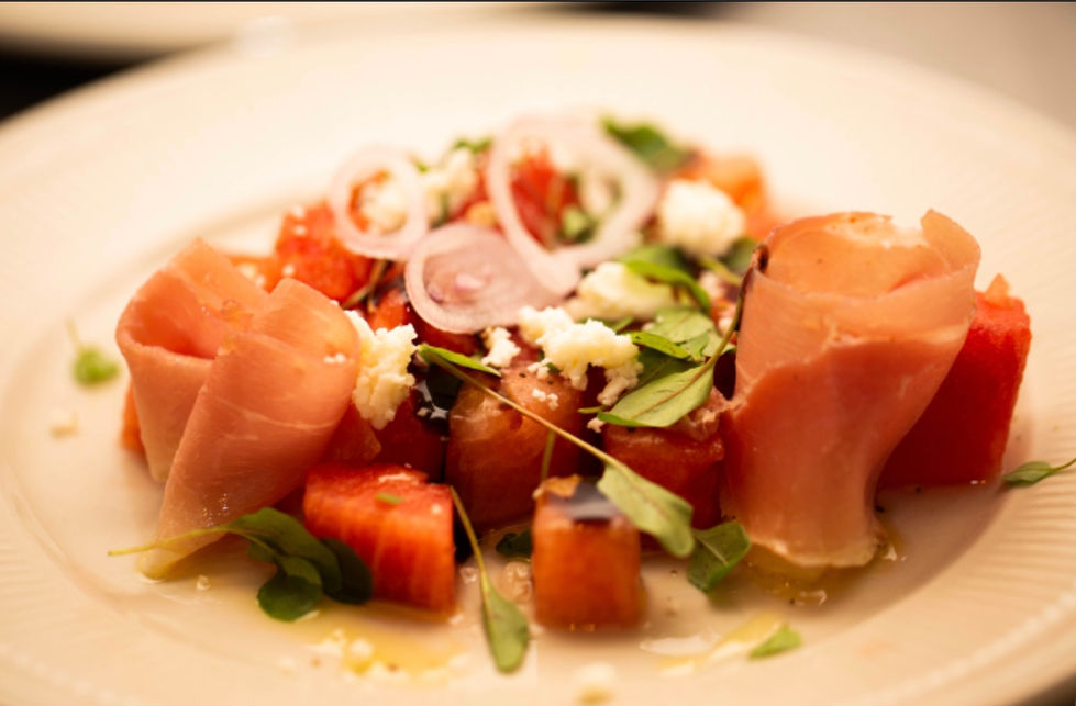 a close up of a plate of food with meat and vegetables