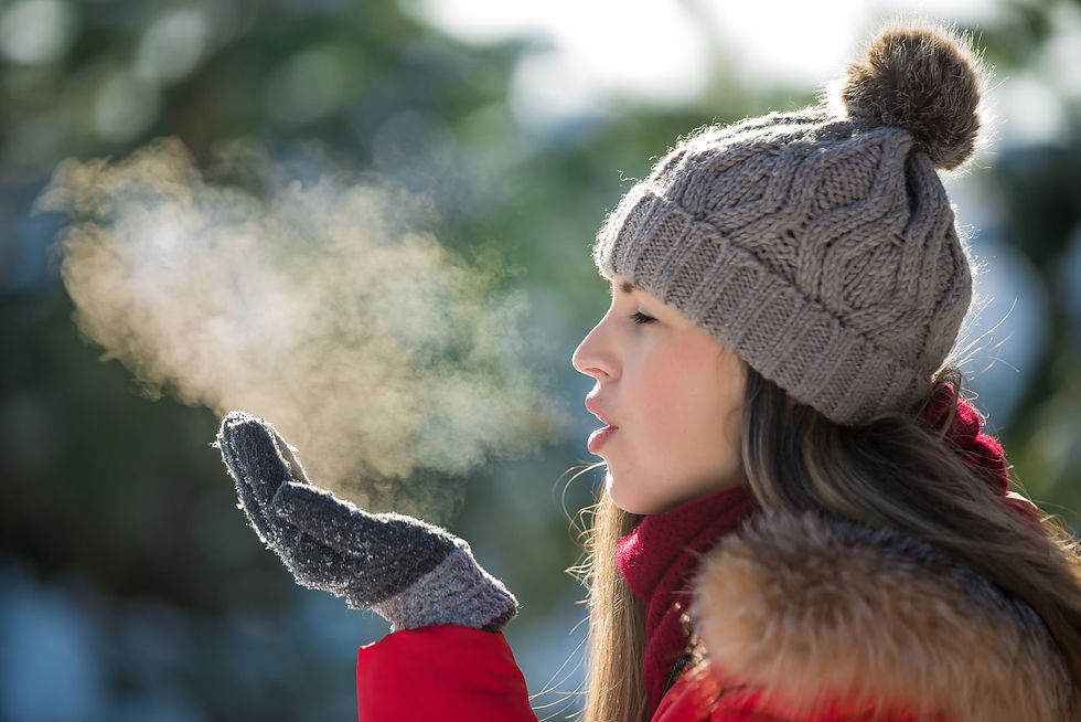 Woman showing water loss through vapor, blowing vapor clouds in winter