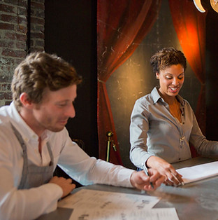 two-colleagues-collaborating-over-paperwork-in-a-c-2025-04-04-23-39-10-utc.jpg
