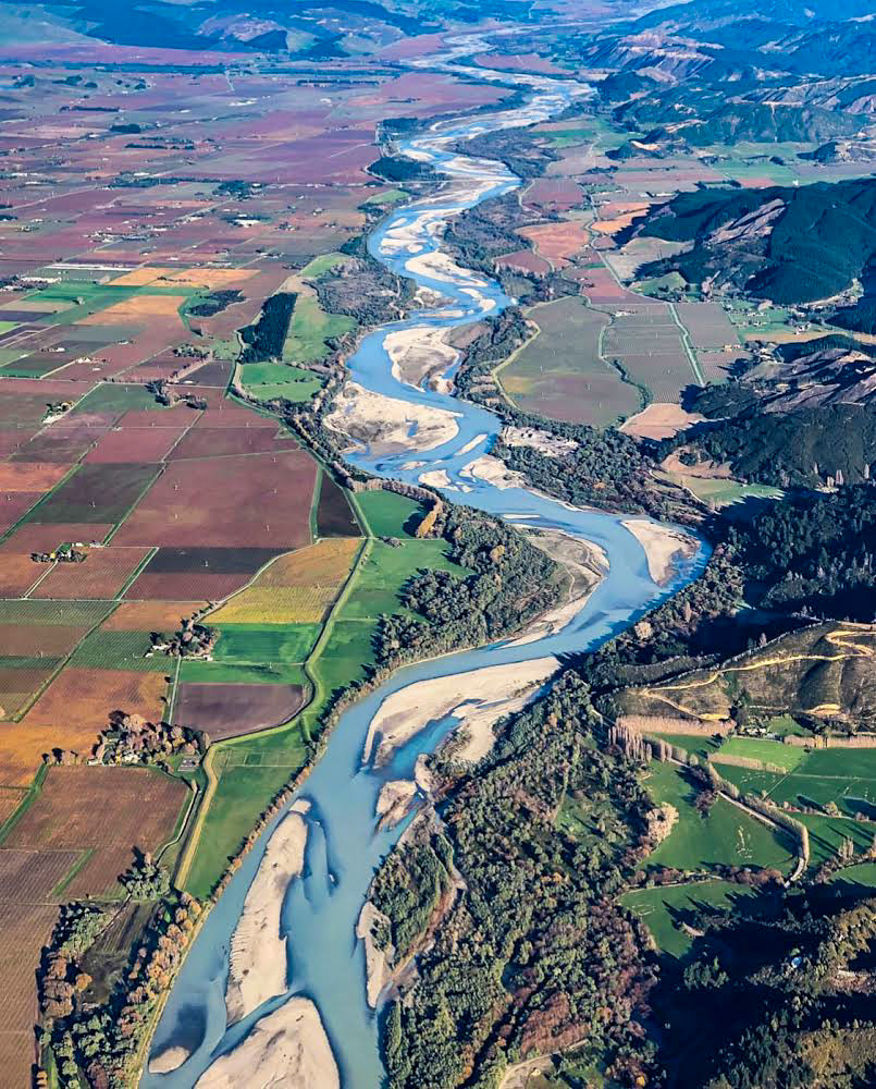 overhead view from the plane of blenheim new zealand in winter with vineyards and rivers and snow on a clear day, marlborough, wine country, drink, life in new zealand, wanderlust wednesday