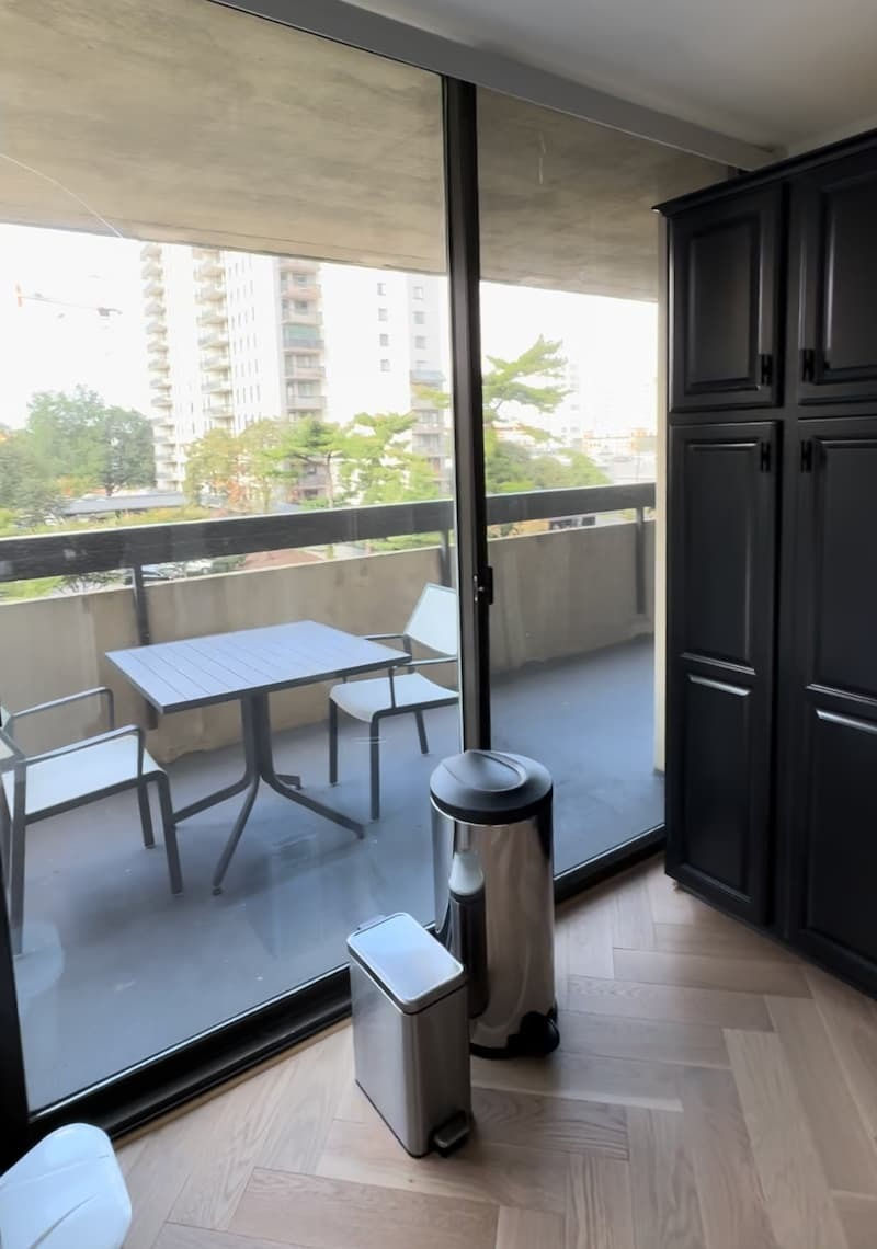 Full condo renovation Alexandria VA with tall pantry cabinet columns flanking the range