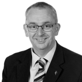 Headshot of a man in a suit