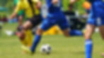 Two people playing football