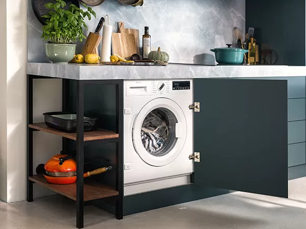 Neff washing machine behind cupboard door