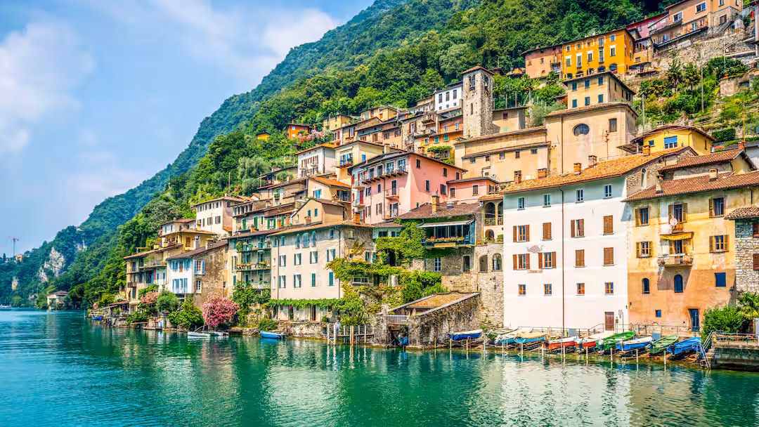 This image shows the historical fishermen village of Gandria, located on the shores of Lake Lugano in the Ticino region of Switzerland. 