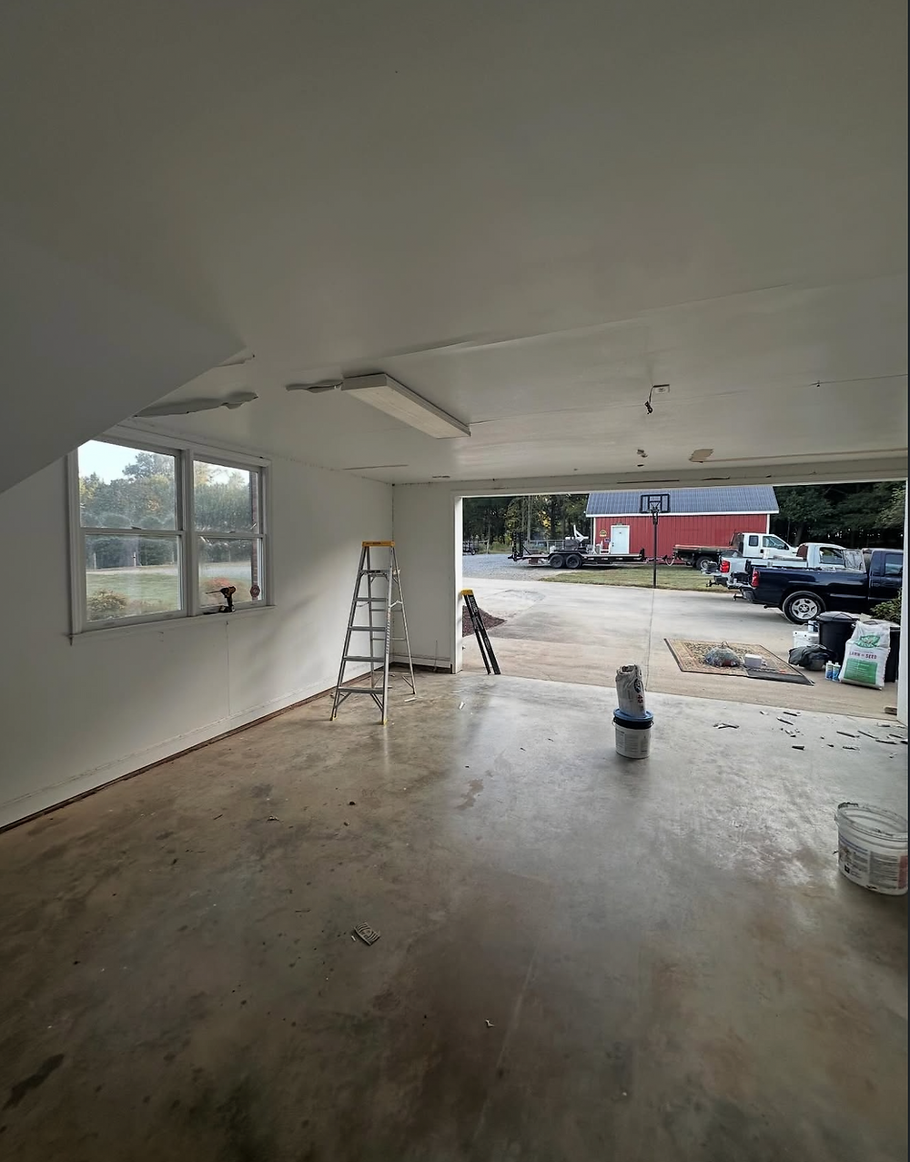 Newly finished white drywall in a garage