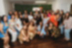 group of latinas smiling for a group photo at a public speaking event 