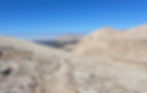 A trail on a rocky bare mountainside