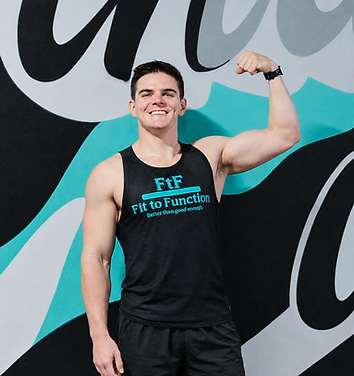 Confident Flex Against Teal Mural.png