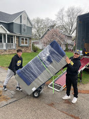 Movers moving a refrigerator