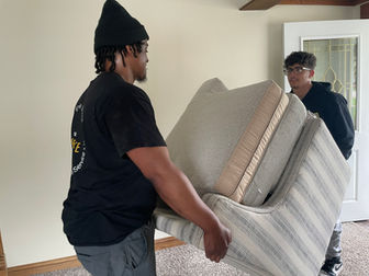 Movers Moving a Sofa
