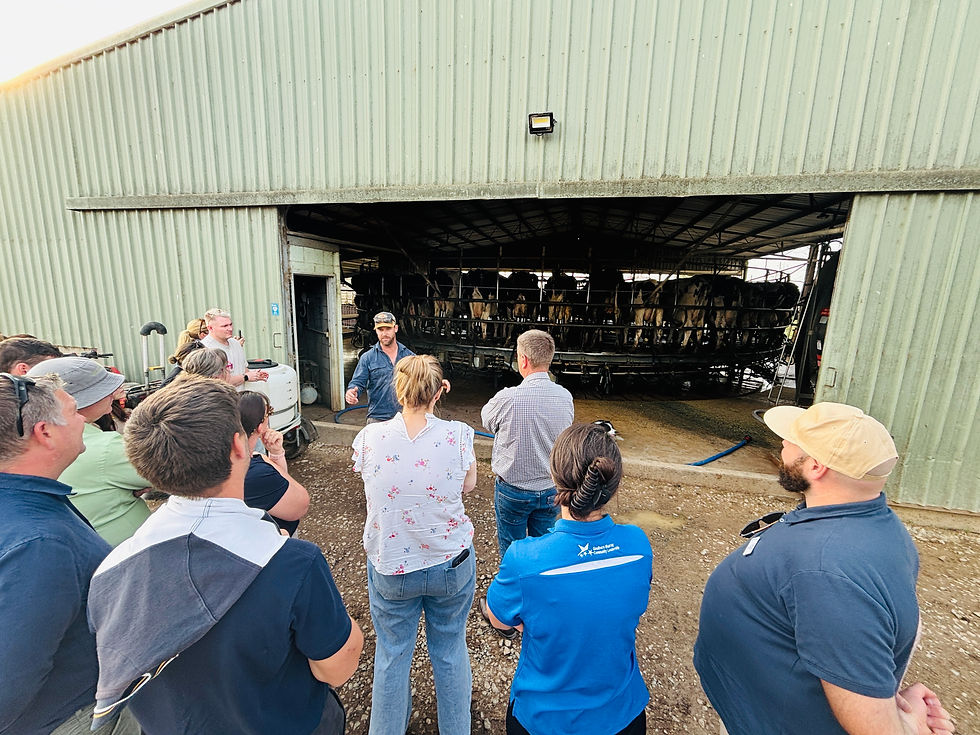 Photo 6 - Andrew Murphy (FF’23) speaking with the cohort at the Murphy family dairy farm