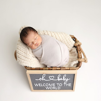 Newborn baby boy swaddled and sleeping in studio – Torrance newborn photography”