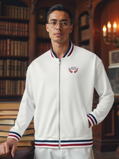 A Hispanic male tennis player stands confidently in Ascot Manor Sport apparel.
