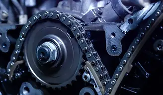 An image of a timing chain in the internals of a car