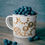 Thumbnail: Gears on an Enamel Camping Mug