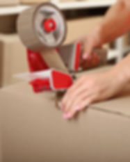 Person Taping Box at Warehouse