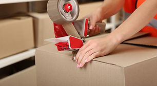 Person Taping Box at Warehouse - size limitations for transporting custom cases - ATS Cases