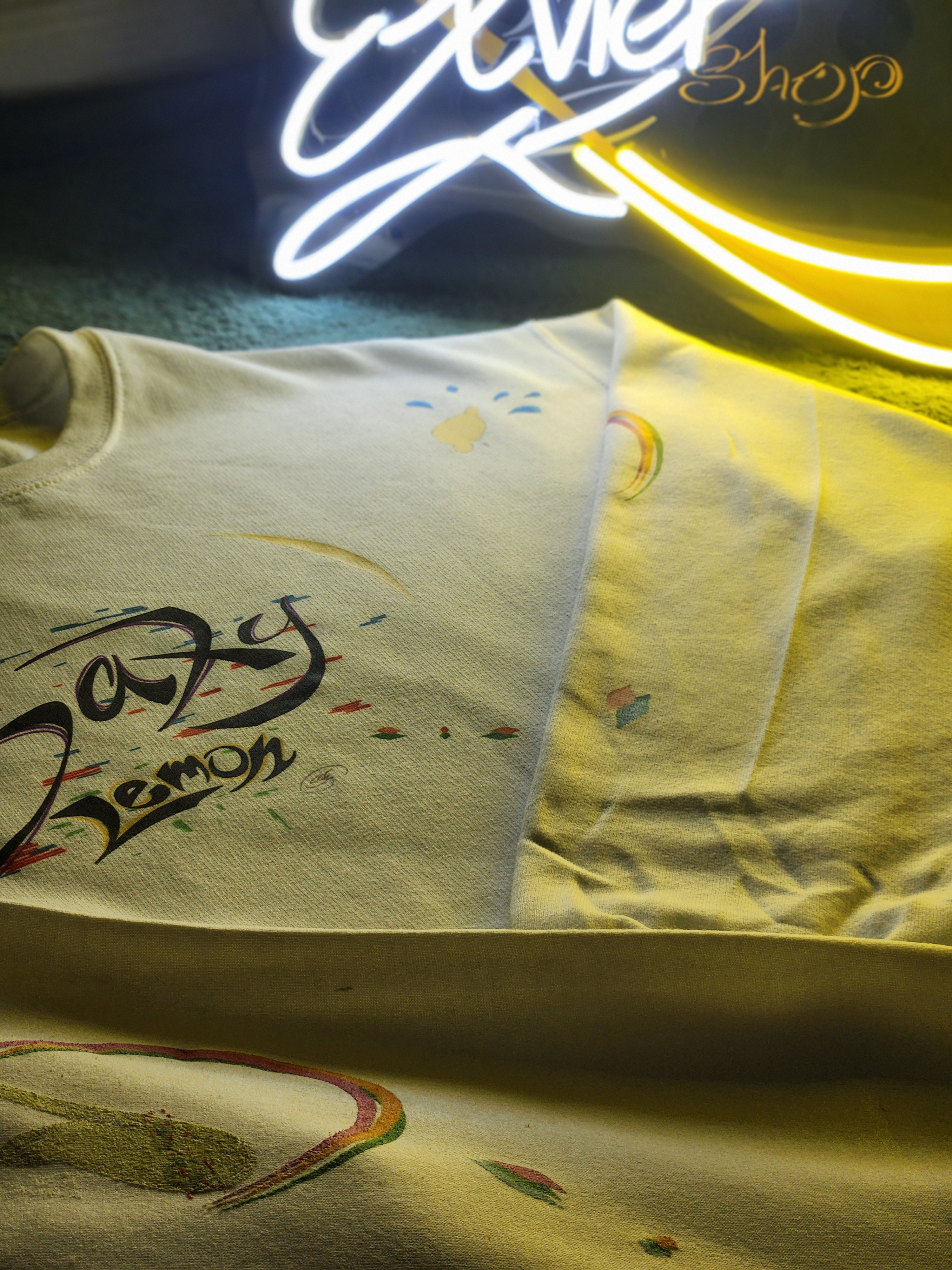 New white hoodie presenting Saxy Lemon graphic for sale