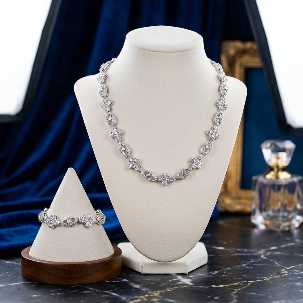 Elegant silver-toned necklace and matching bracelet set displayed beautifully on mannequins.