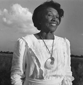 woman outside in a white dress