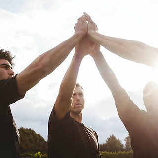 Group of men celebrate quitting smoking for good.