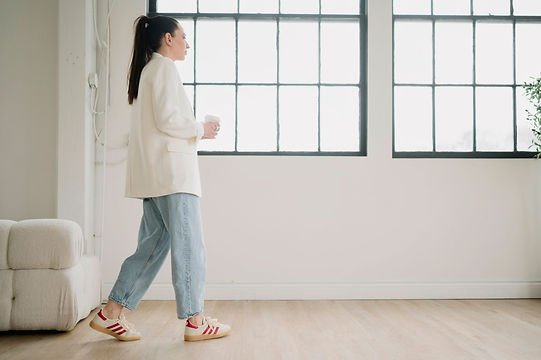Brittany walking through a welcoming wellness space