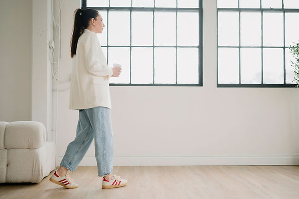 Brittany walking through a calm wellness space
