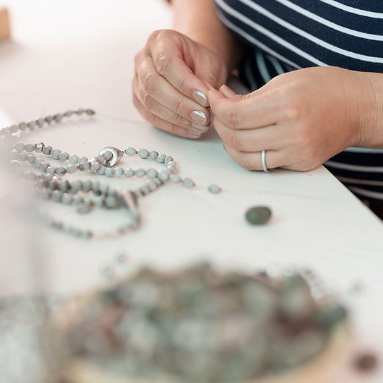 threading a beaded necklace