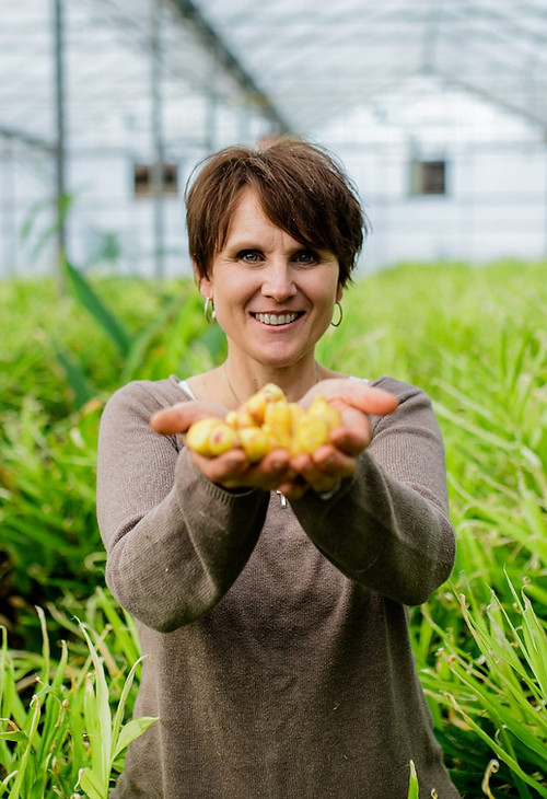 Cindy Mueller at her farm holding ginger