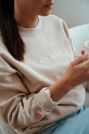 Brittany wearing Pretty Hearts Club sweater by Well Within Collective
