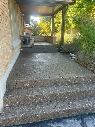 Exposed aggregate concrete driveway installed by Caligiuri & Sons Construction in Niagara Falls