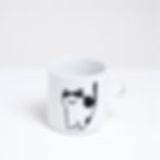 Thumbnail: A white porcelain mug, made in Japan, with a line-art illustration of a white cat with black patches