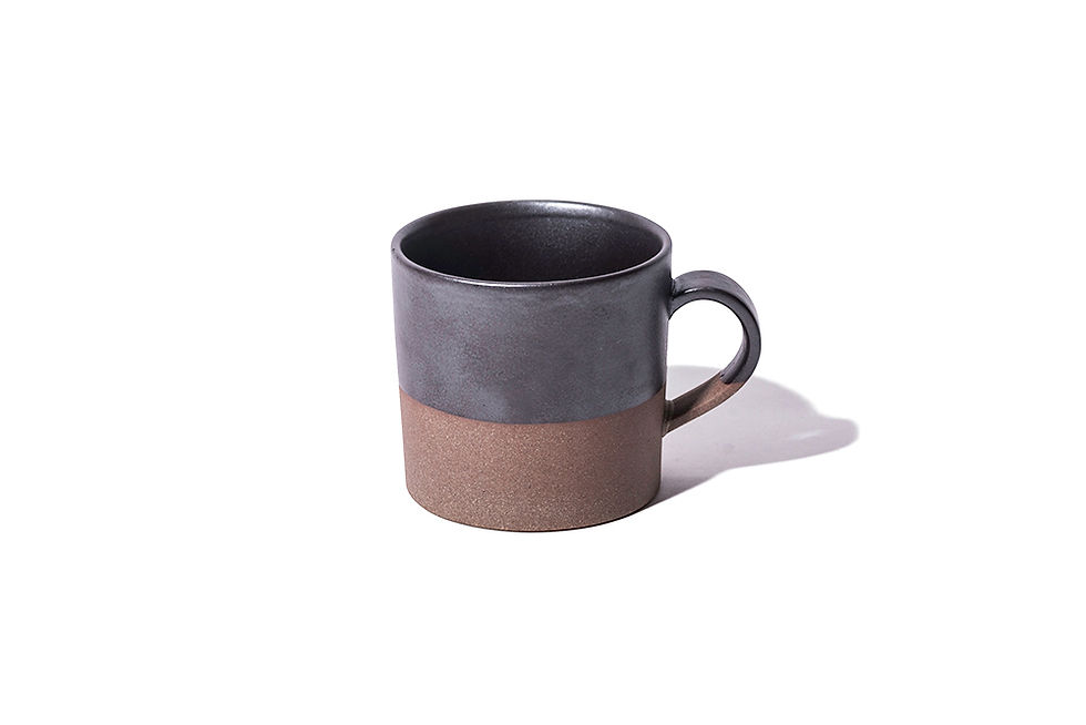 Thumbnail: Dark gray and natural brown, two-tone ceramic mug with a handle. The top half is glazed, leaving the bottom half in its natural clay colour. Designed by Angle in Japan.