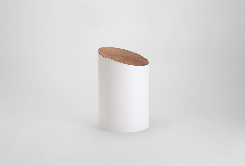 Thumbnail: A cylindrical, small, minimalist, white swing bin with a slanted oval, walnut wood lid.