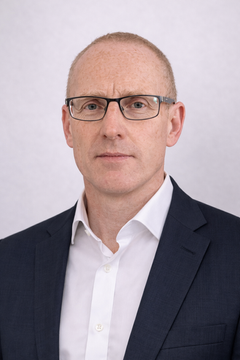 man in glasses wearing suit