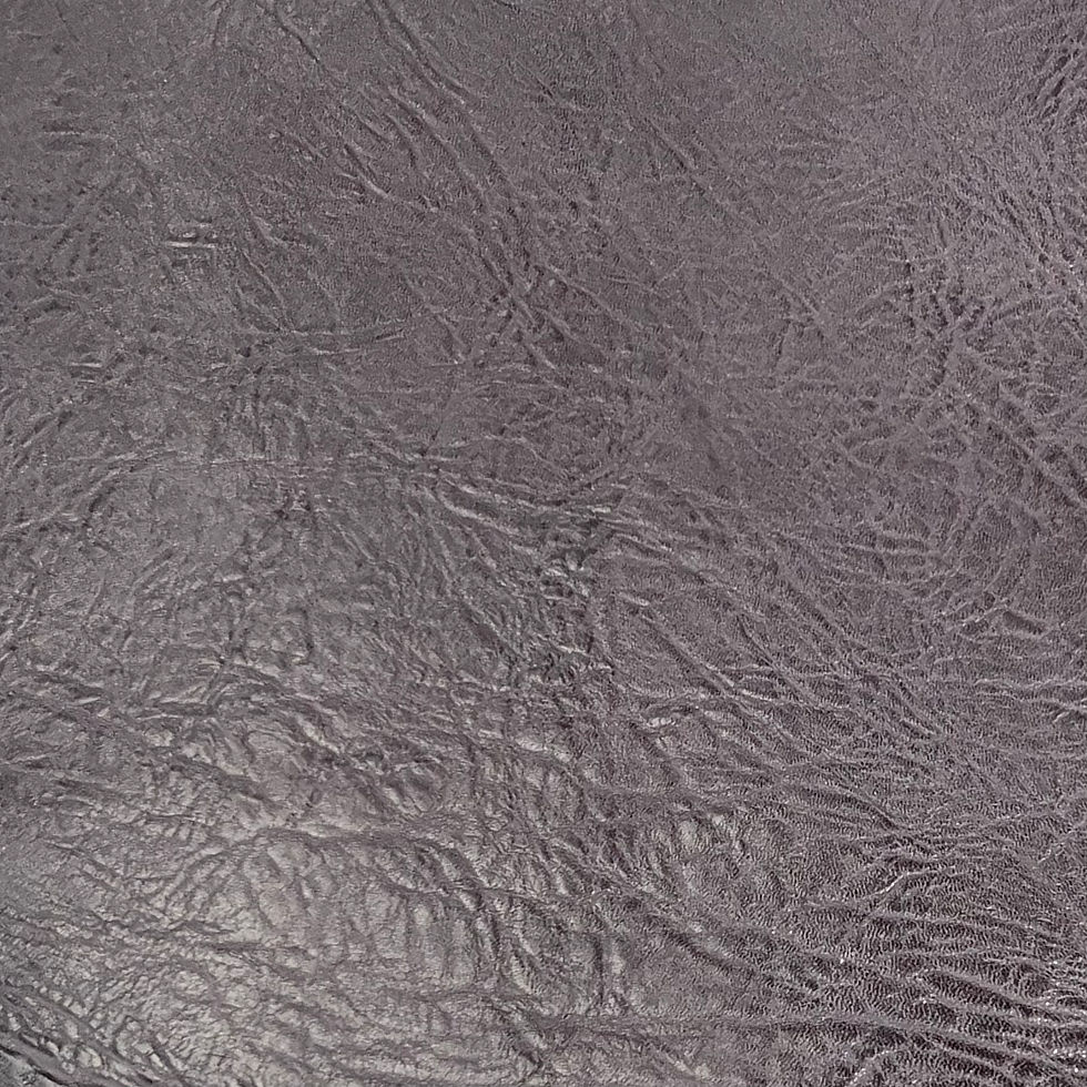 Close up of distressed textured, aged purple gray chrome-tanned calf leather