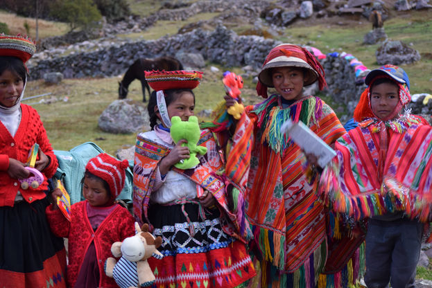 Andean children wearing traditional colorful clothing in a village along the Lares Trek in Cusco Peru