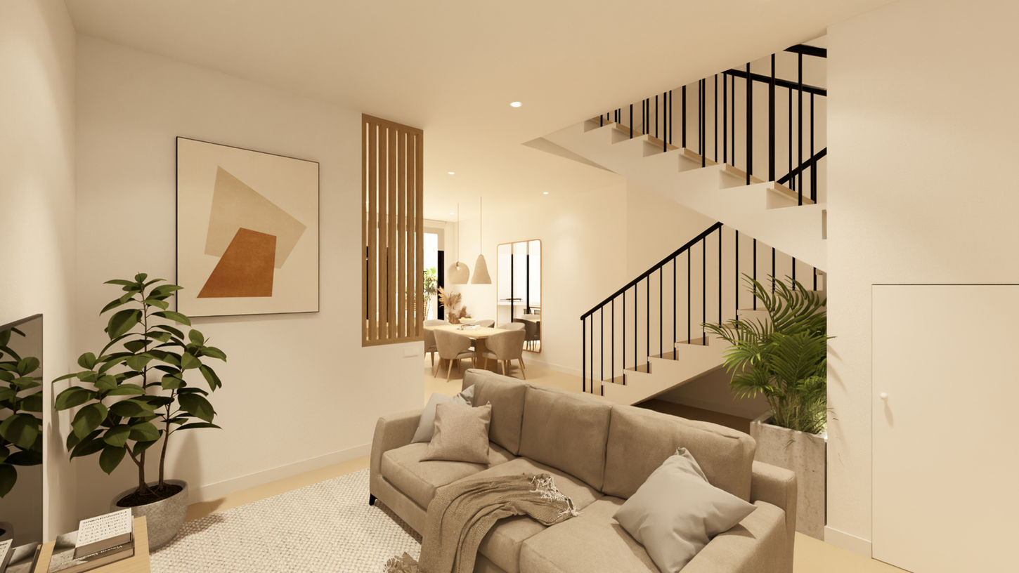 Sala de estar contemporánea en vivienda unifamiliar diseñada por Genovés Calleja Arquitectos, con sofá neutro, escalera abierta y conexión visual con comedor en un espacio luminoso y funcional.