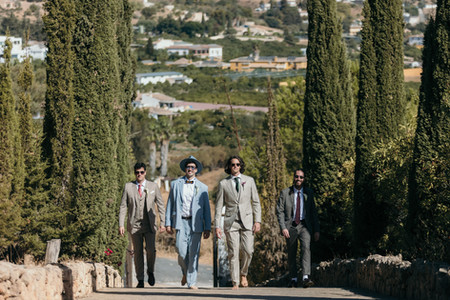 Wedding party walking through a scenic Costa del Sol venue during a destination wedding