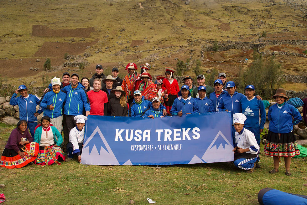 Kusa Treks trekking team with travelers and local community in the Andes near Cusco Peru