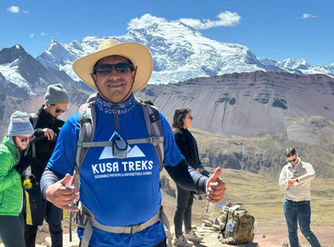 Kusa Treks certified tour guide with hikers at Rainbow Mountain Vinicunca in the Peruvian Andes near Cusco