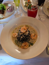 Elegant Peruvian fusion seafood dish served during a romantic gourmet dinner experience in Peru