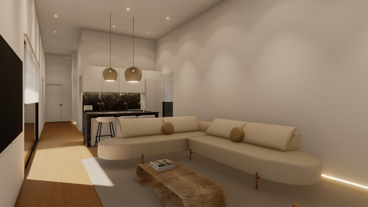 Salón contemporáneo con sofá curvo y cocina integrada al fondo en vivienda unifamiliar Casa Chiva, diseño de Genovés Calleja Arquitectos con enfoque Passivhaus y espacios abiertos luminosos.