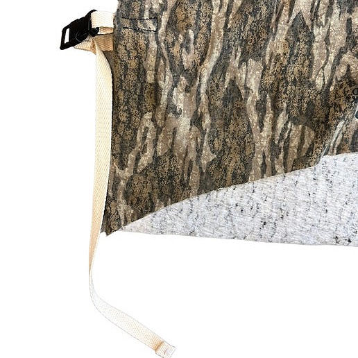 detail of realtree camo cotton oversize tee shirt body, fully open sides held together with canvas straps and buckles.