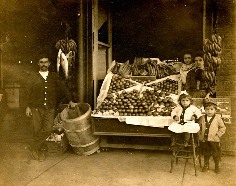 Correro family at Sam Correro’s Market, 217 South Walnut Street, Greenville, Mississippi, circa 1909. Pictured are Mary Grace “Mamaw” Correro, Mary Correro (in the white blouse), Minnie (on the stool), Lee Correro, and Joseph Correro on the left.