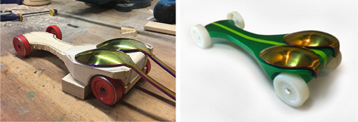 Build progress of a pinewood derby car with double canopies. Green with light green stipe and white wheels.