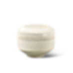 White ceramic jar with a lid on a plain white background. The jar has a smooth, rounded shape and a minimalist design.