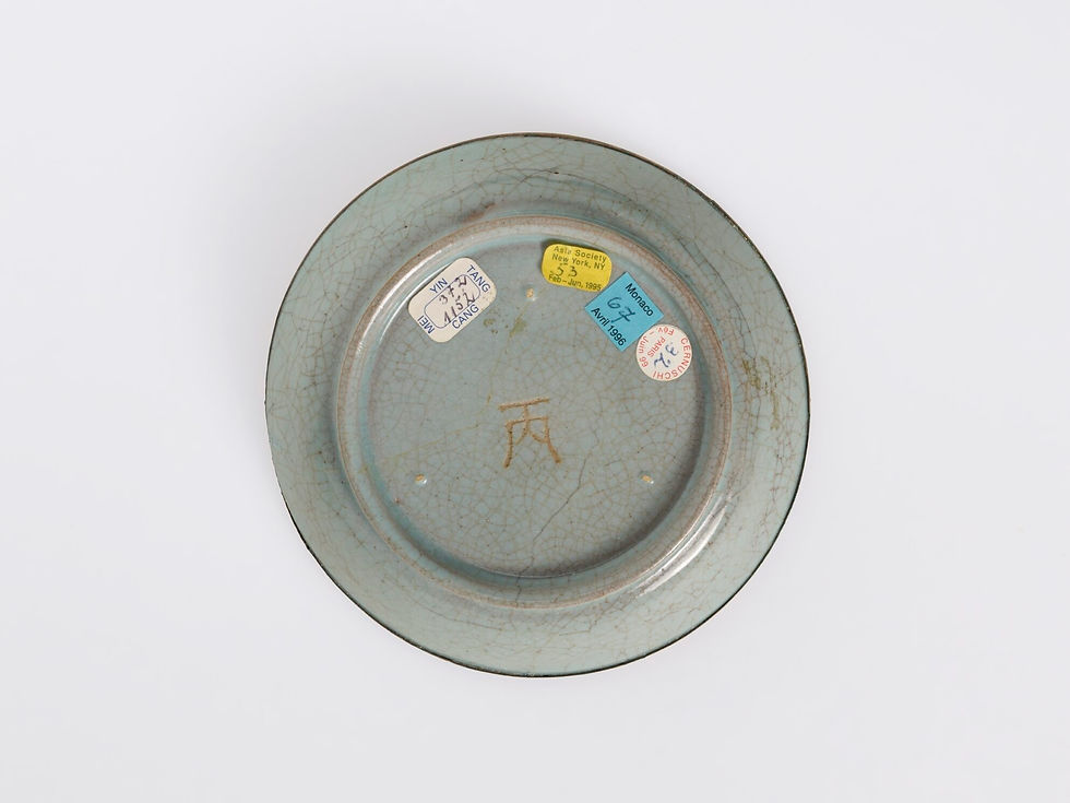ru ware, northern song dynasty: A decorative plate with a crackled glaze and faded green hue, displaying various labels in blue, yellow, and red with text.